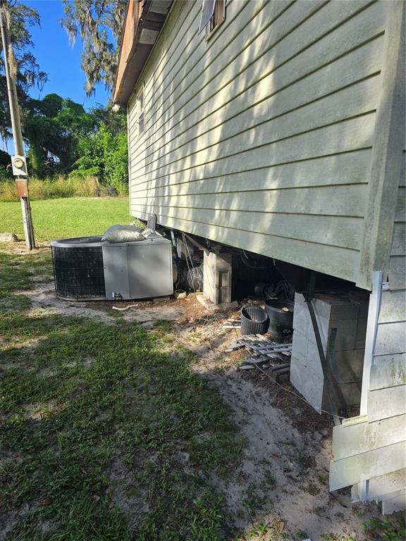 513 Smith Road Polk City, FL 33868 - Photo 21 of 33 a view of a house with a yard