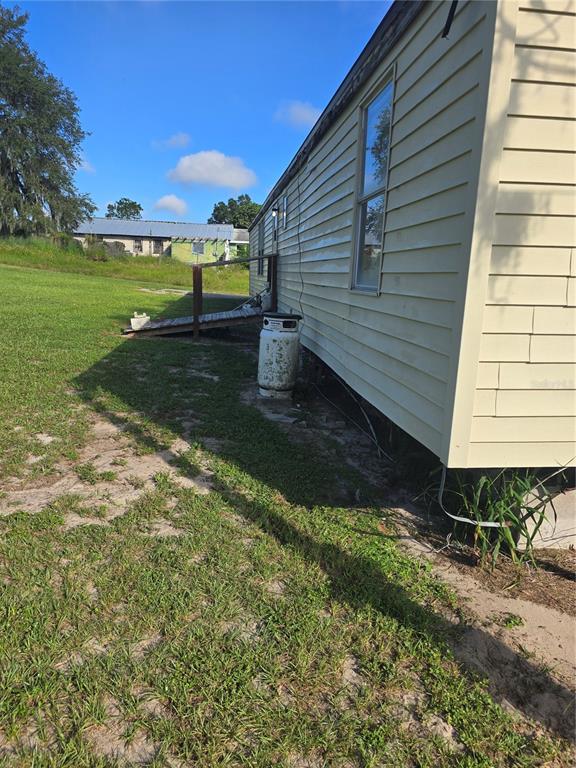 513 Smith Road Polk City, FL 33868 - Photo 23 of 33 a view of a back yard of the house