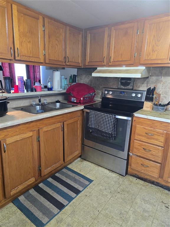 513 Smith Road Polk City, FL 33868 - Photo 3 of 33 a kitchen with a sink and cabinets