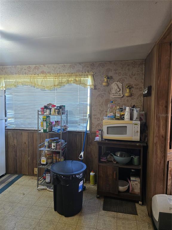 513 Smith Road Polk City, FL 33868 - Photo 4 of 33 a living room with a couch and a table
