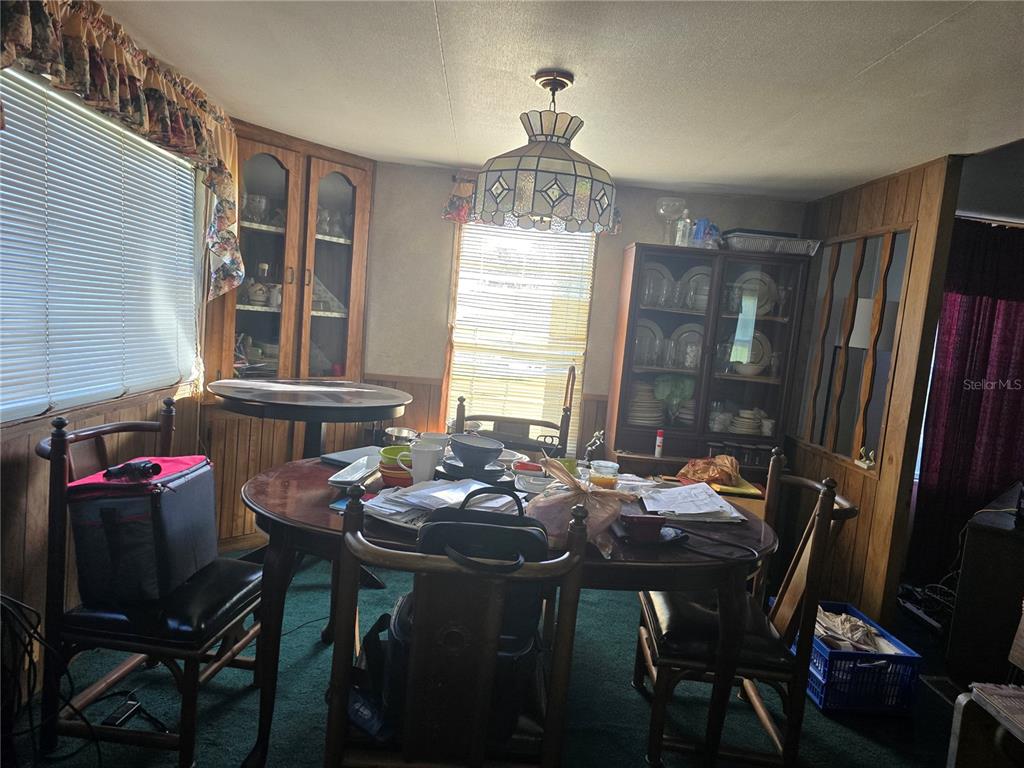 513 Smith Road Polk City, FL 33868 - Photo 5 of 33 a view of a dining room with furniture window and outside view