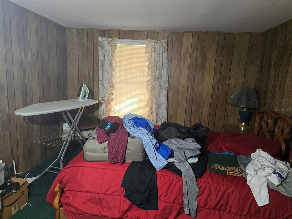 513 Smith Road Polk City, FL 33868 - Photo 9 of 33 a bed room with a bed and a window