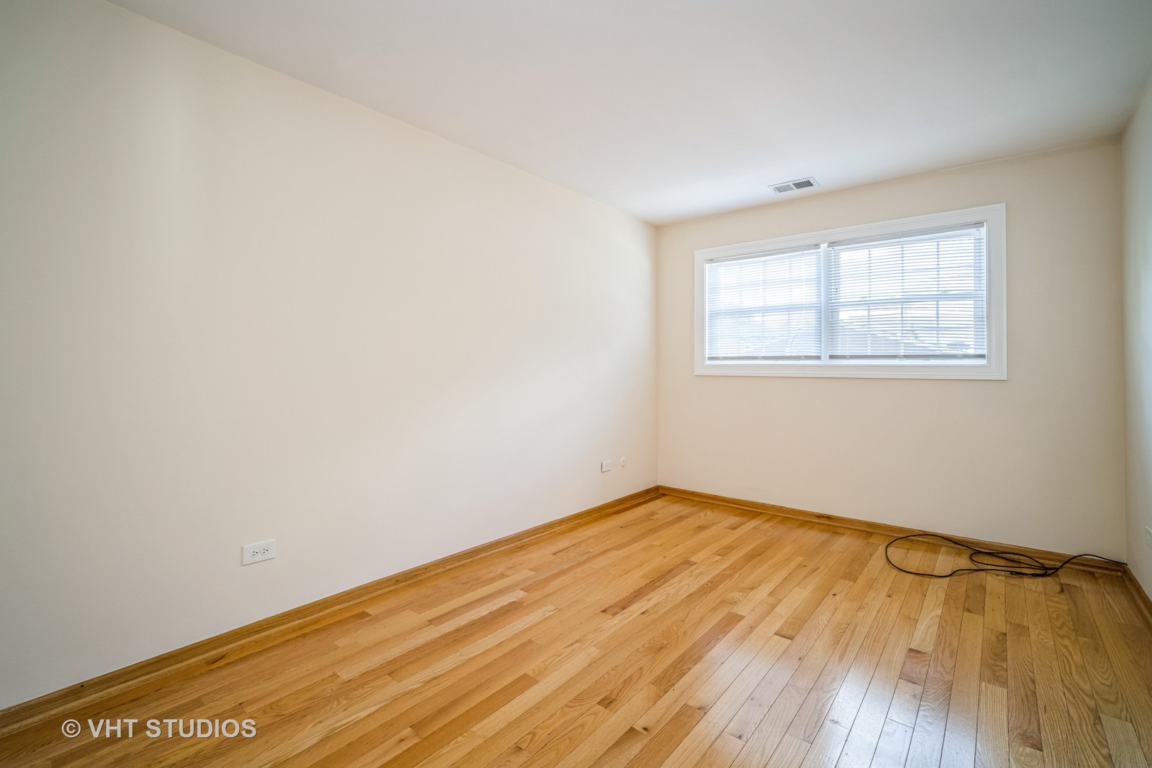 684 Cleo Court, Unit 684 Wheeling, IL 60090 - Photo 11 of 13 an empty room with wooden floor and windows