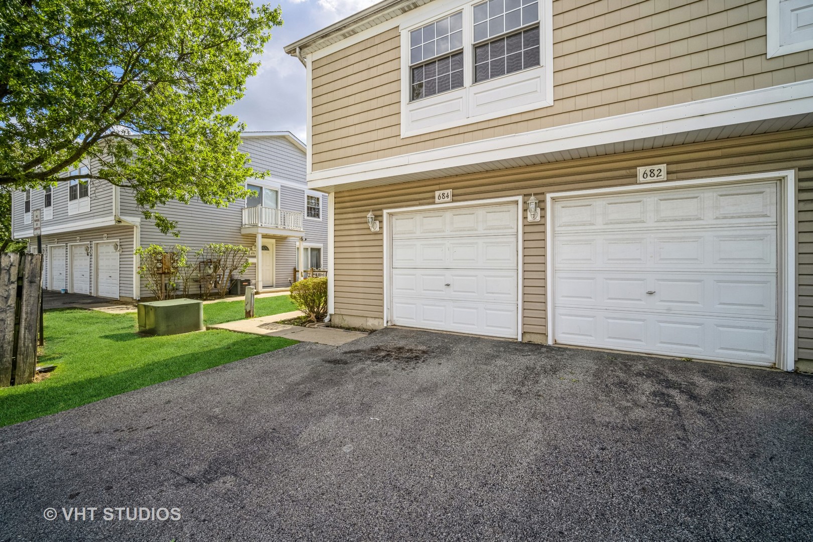 684 Cleo Court, Unit 684 Wheeling, IL 60090 - Photo 13 of 13 a view of a house with a backyard