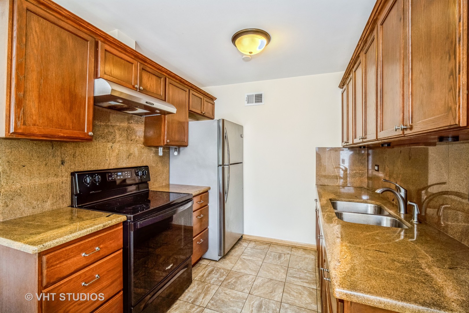 684 Cleo Court, Unit 684 Wheeling, IL 60090 - Photo 6 of 13 a kitchen with stainless steel appliances granite countertop a stove a sink and a refrigerator