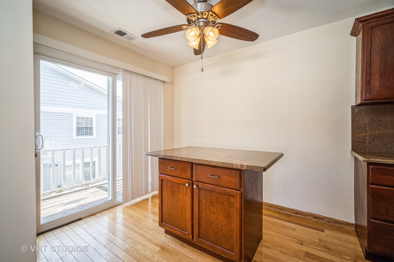 684 Cleo Court, Unit 684 Wheeling, IL 60090 - Photo 7 of 13 a view of a room with wooden floor and staircase