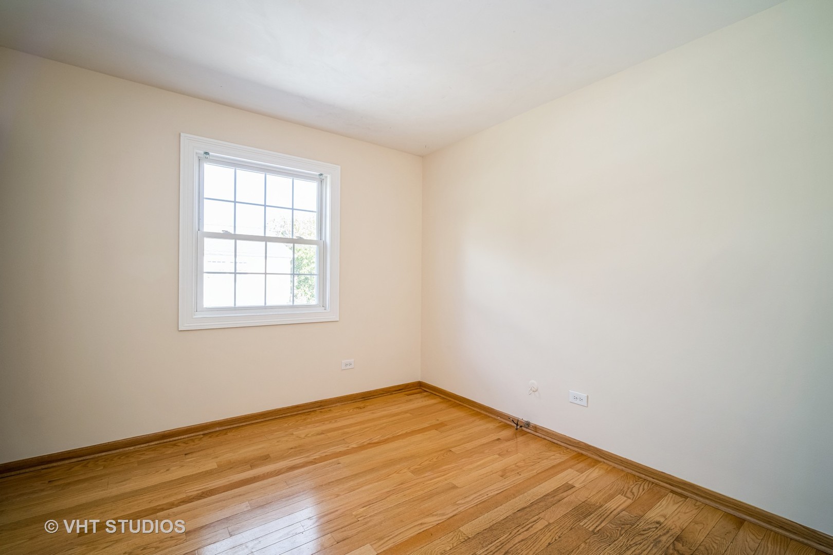 684 Cleo Court, Unit 684 Wheeling, IL 60090 - Photo 9 of 13 an empty room with wooden floor and windows