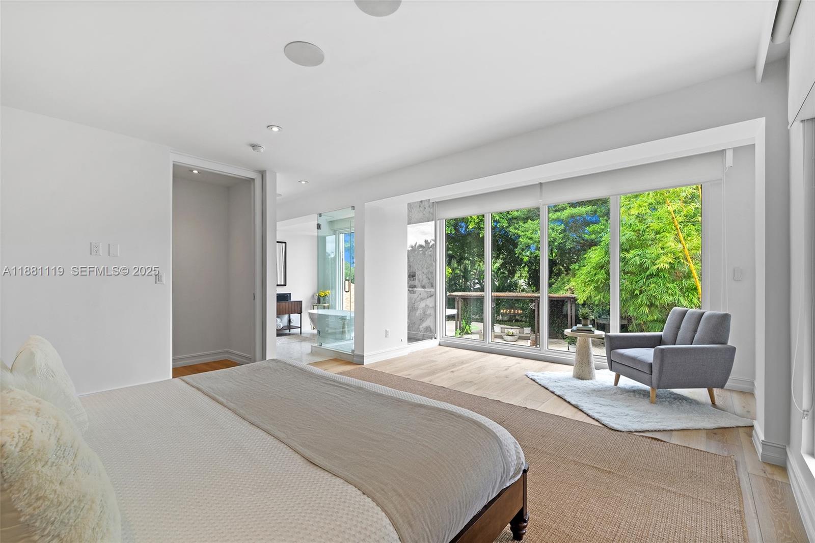 575 Bay Point Road Miami, FL 33137 - Photo 11 of 87 a bedroom with a large bed and a large window