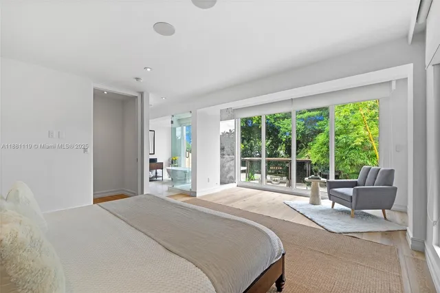 a bathroom with a sink a mirror and a window