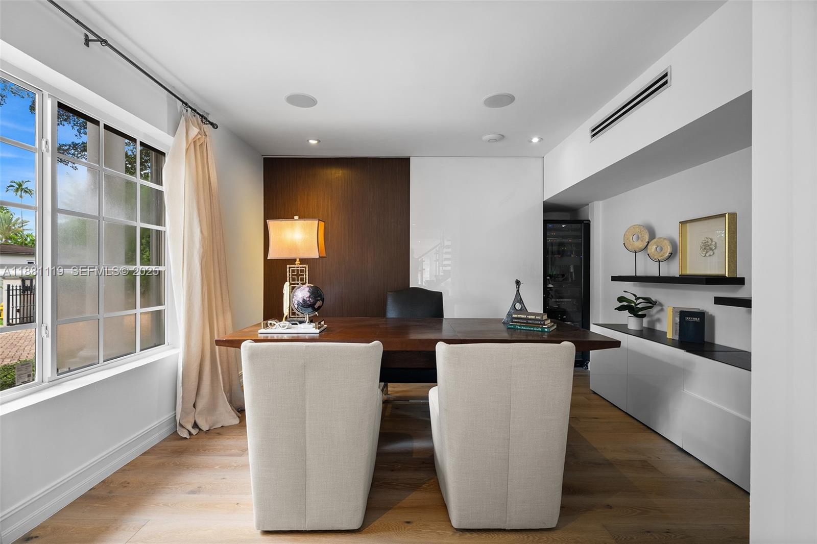 575 Bay Point Road Miami, FL 33137 - Photo 13 of 87 a living room with couches and painting on the wall with wooden floor