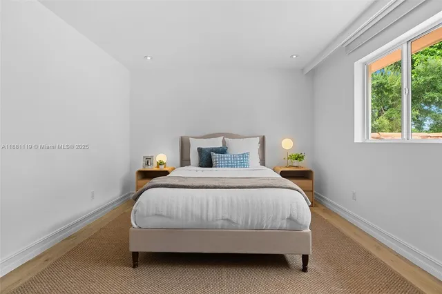 a view of entryway livingroom and hall with wooden floor