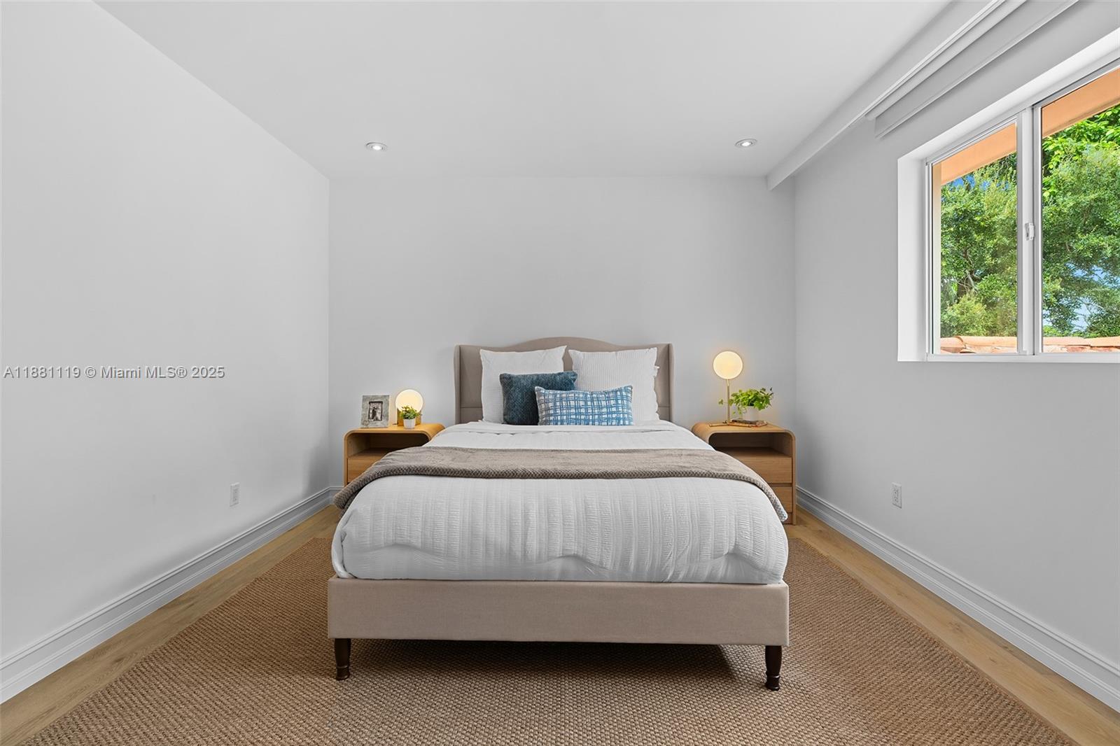 575 Bay Point Road Miami, FL 33137 - Photo 16 of 87 a bedroom with a bed and window