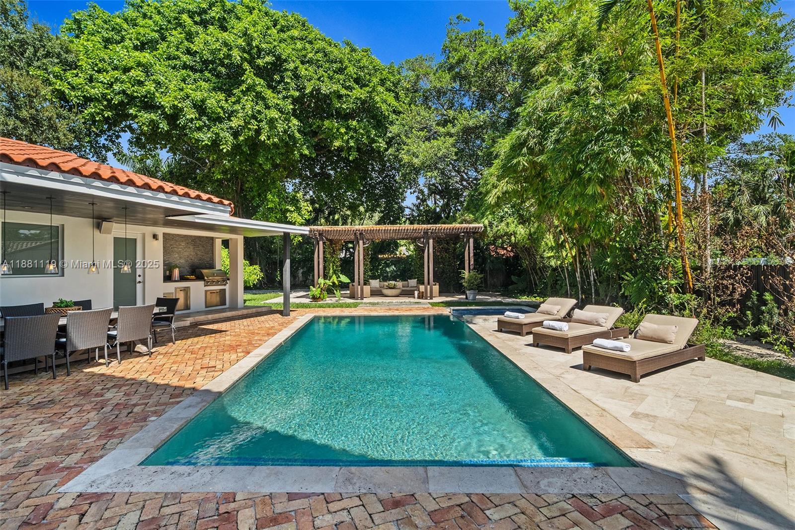 575 Bay Point Road Miami, FL 33137 - Photo 2 of 87 a view of a house with swimming pool and sitting area