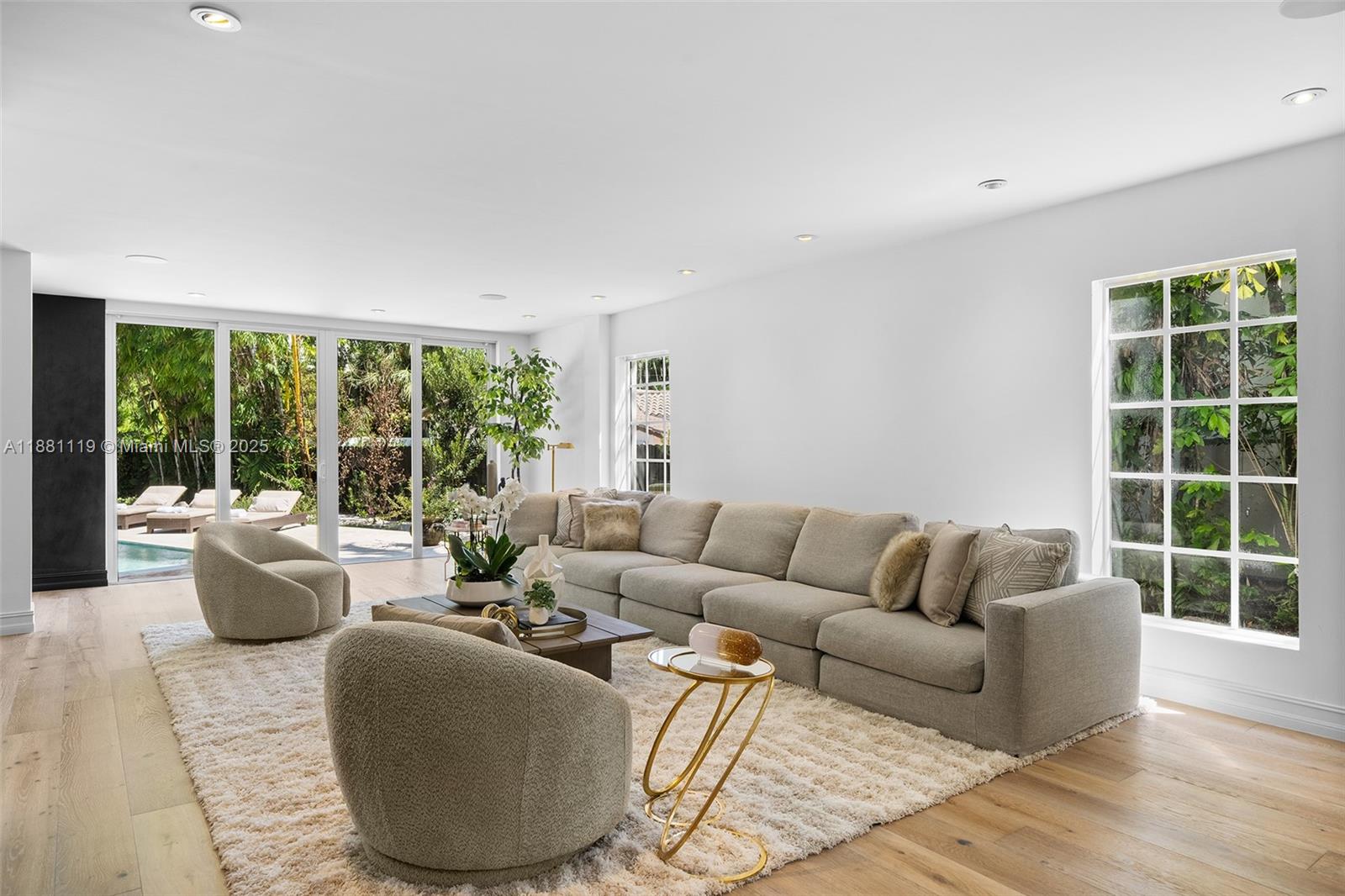575 Bay Point Road Miami, FL 33137 - Photo 25 of 87 a living room with furniture and a large window