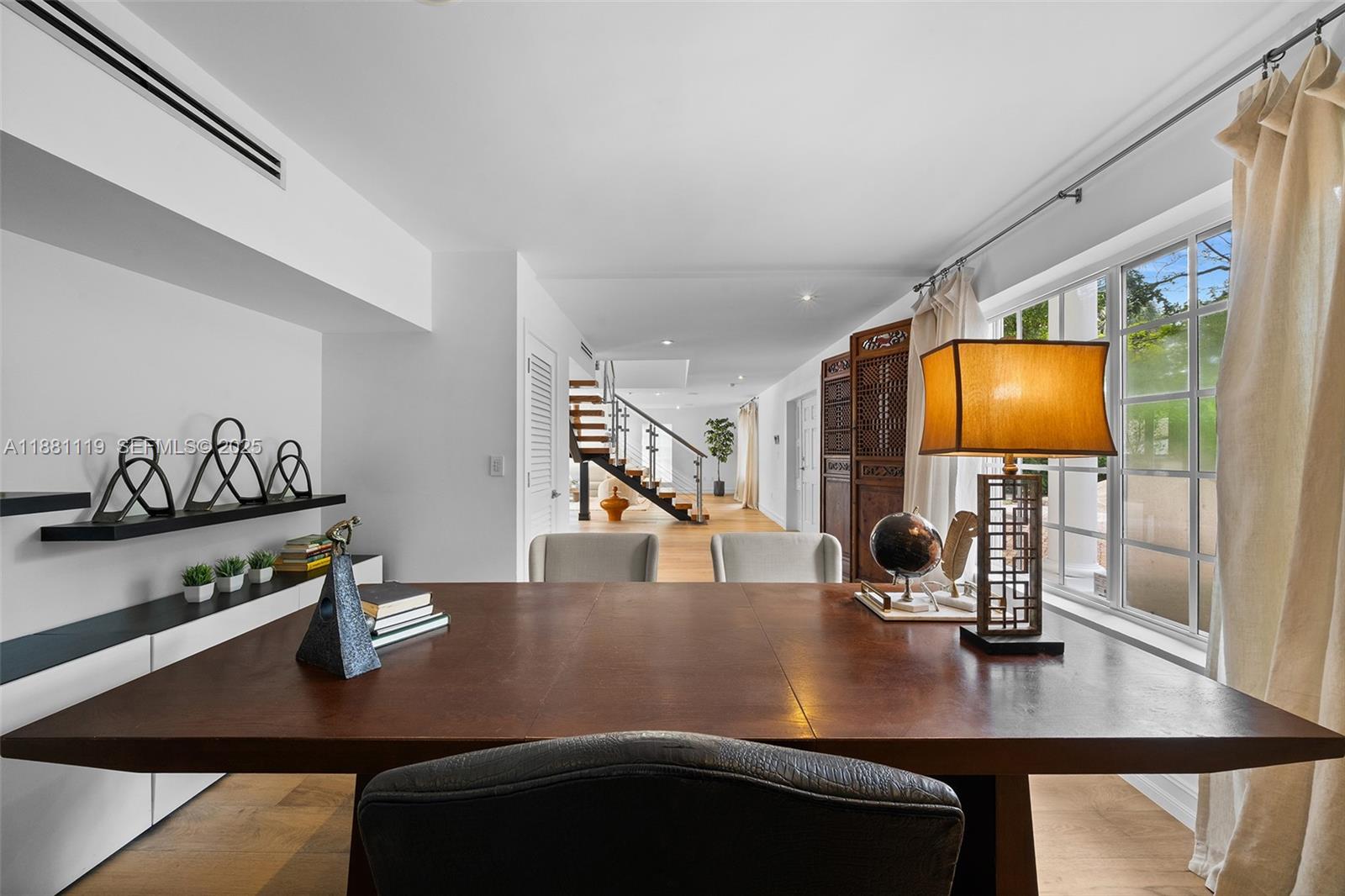575 Bay Point Road Miami, FL 33137 - Photo 43 of 87 a view of a living room and dining room with furniture