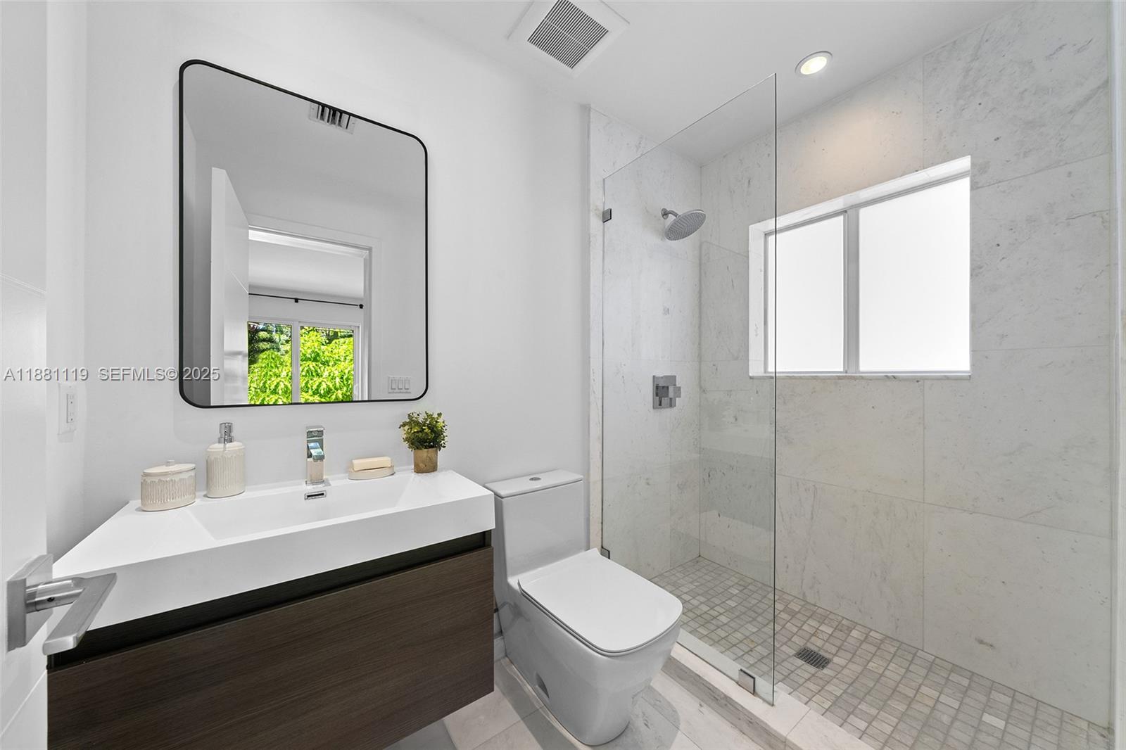 575 Bay Point Road Miami, FL 33137 - Photo 46 of 87 a bathroom with a sink a toilet and shower