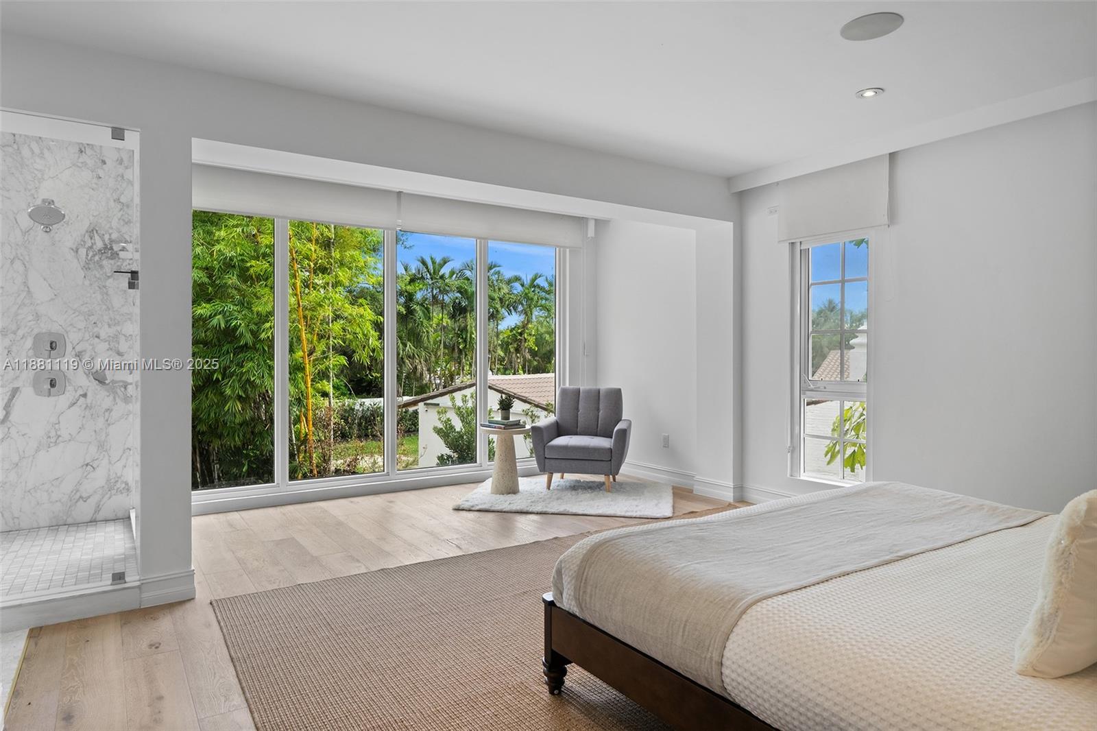 575 Bay Point Road Miami, FL 33137 - Photo 49 of 87 a bedroom with a bed and a large window