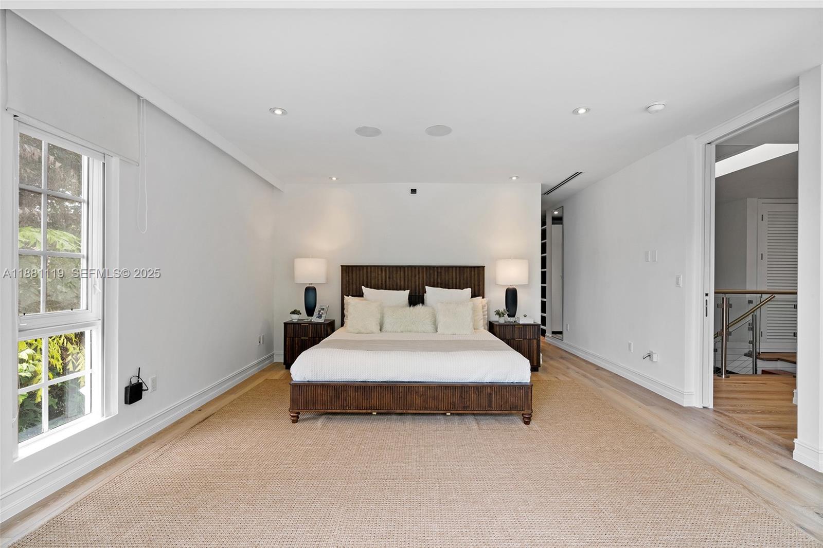 575 Bay Point Road Miami, FL 33137 - Photo 50 of 87 a bed sitting in a bedroom next to a window