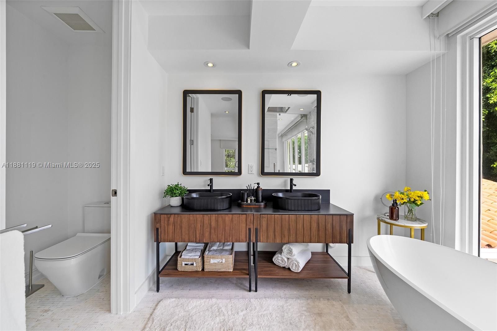 575 Bay Point Road Miami, FL 33137 - Photo 53 of 87 a bathroom with a toilet a sink and a bathtub