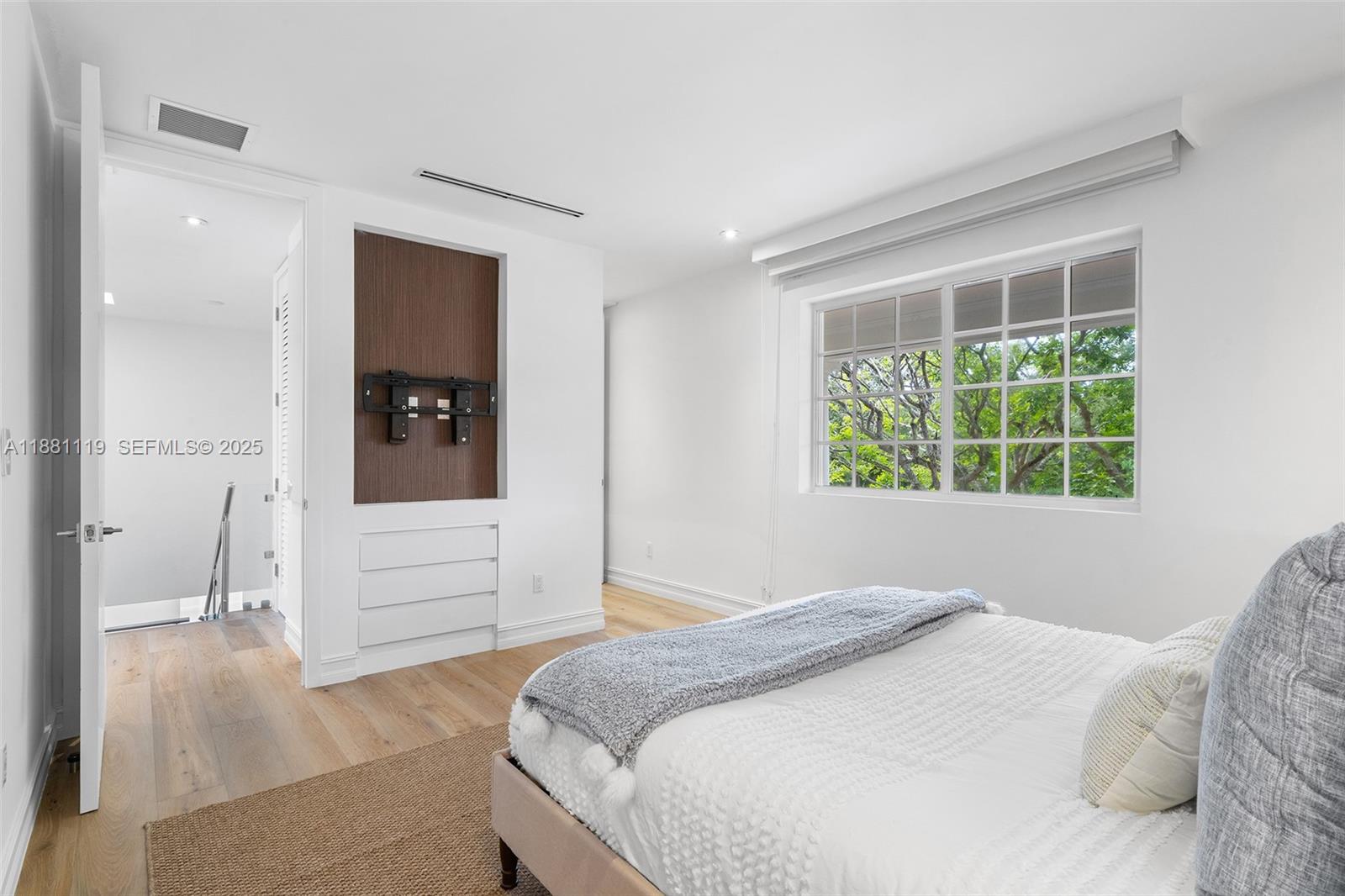 575 Bay Point Road Miami, FL 33137 - Photo 58 of 87 a bedroom with a bed and a large window