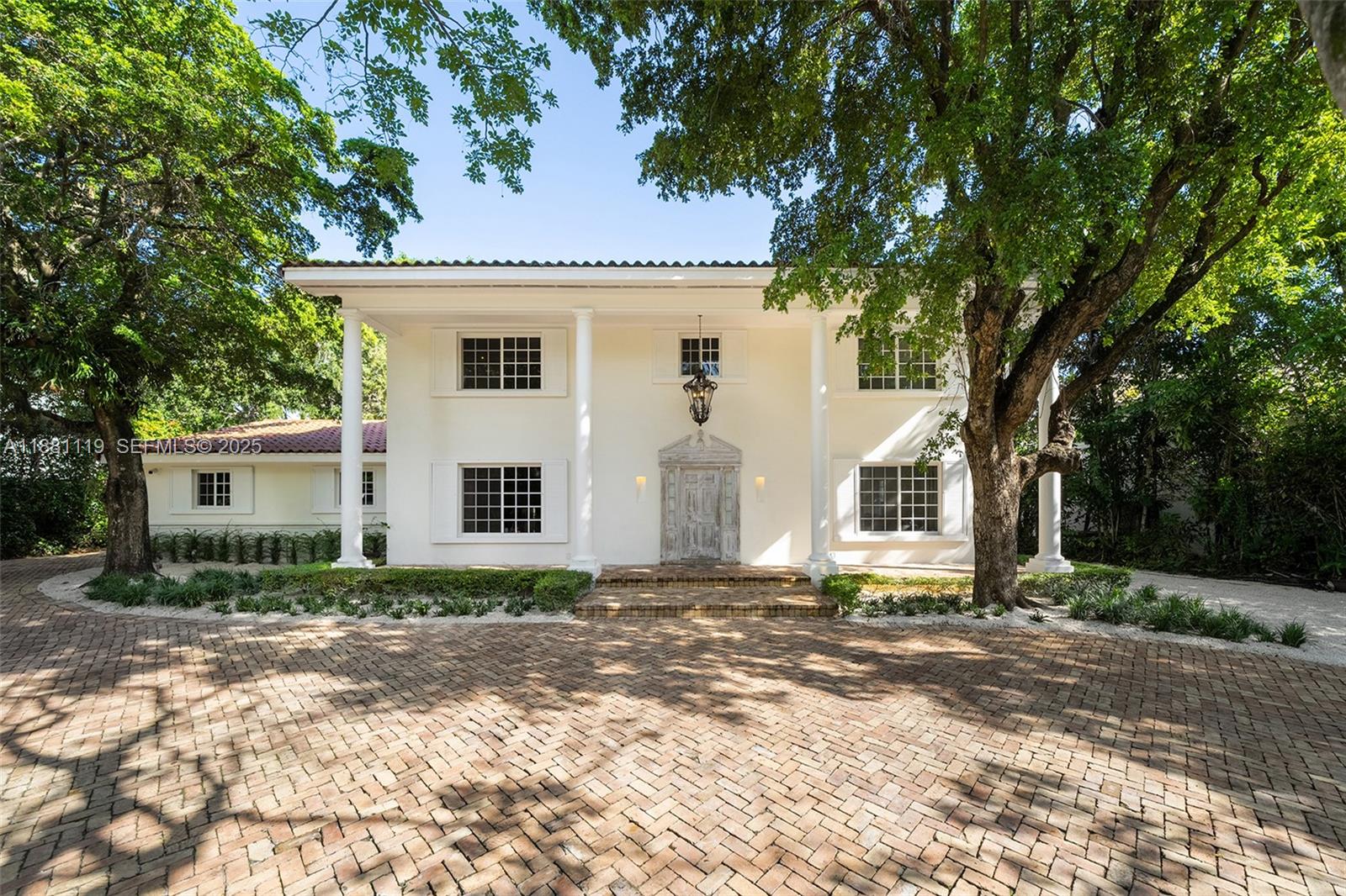 575 Bay Point Road Miami, FL 33137 - Photo 6 of 87 a front view of a house with a yard