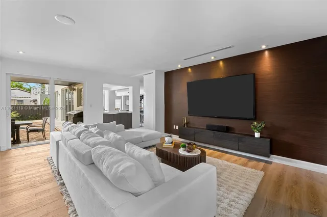 a bedroom with a bed and a television