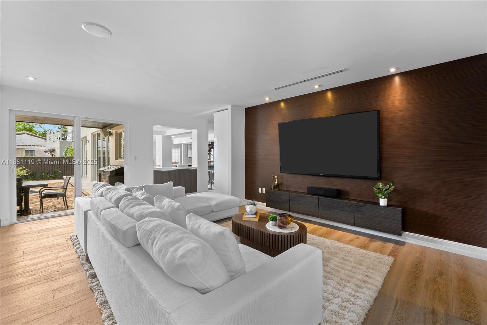 575 Bay Point Road Miami, FL 33137 - Photo 10 of 87 a living room with furniture and a flat screen tv