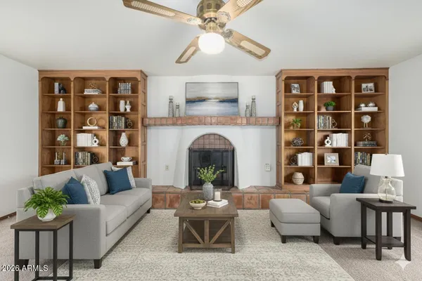 a living room with furniture and a fireplace