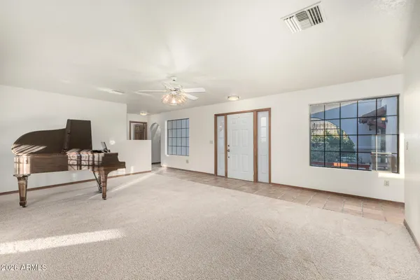 a view of an empty room with windows