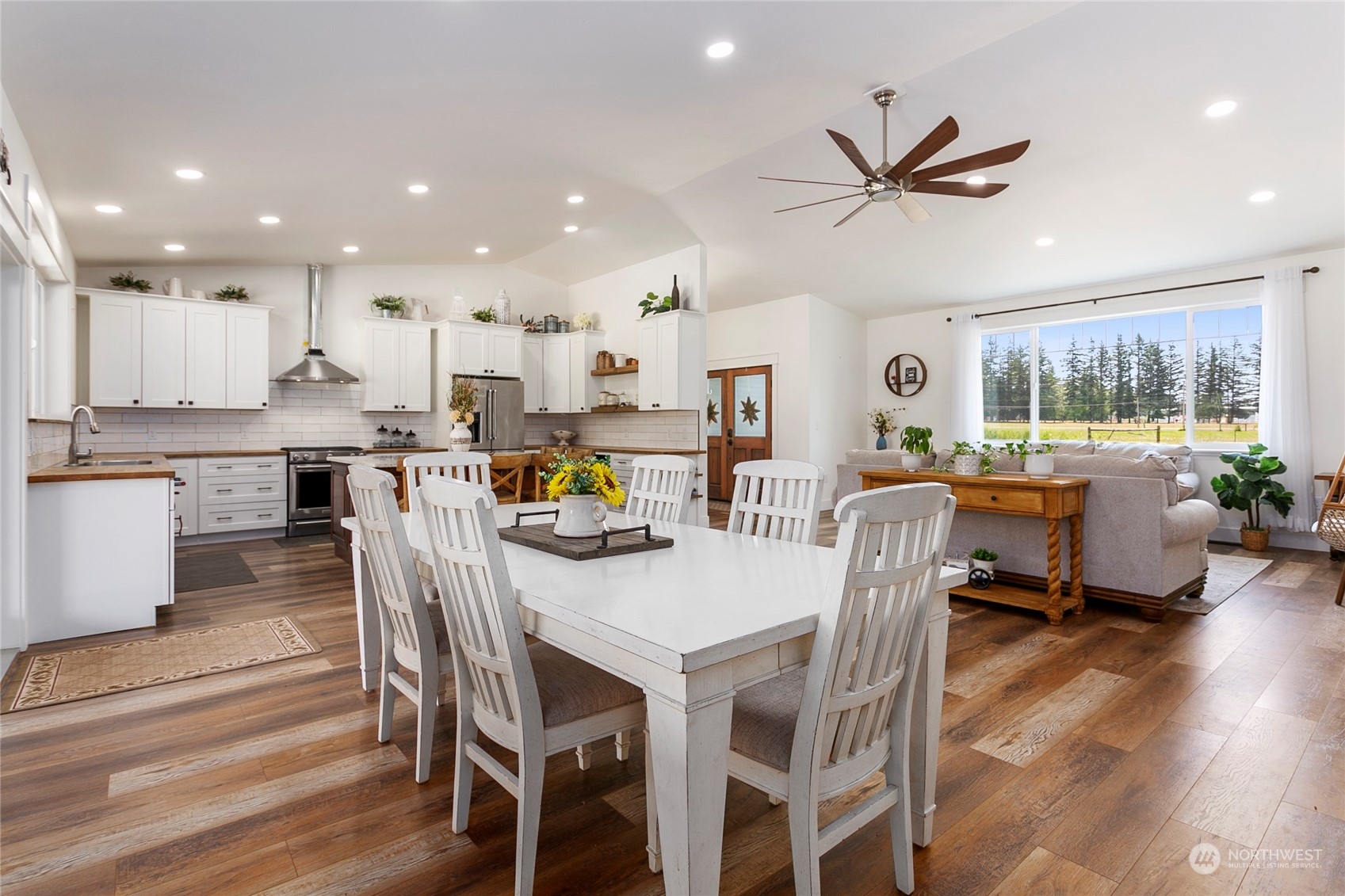 7730 Goodwin Road Everson, WA 98247 - Photo 12 of 39 a view of a dining room with furniture window and wooden floor