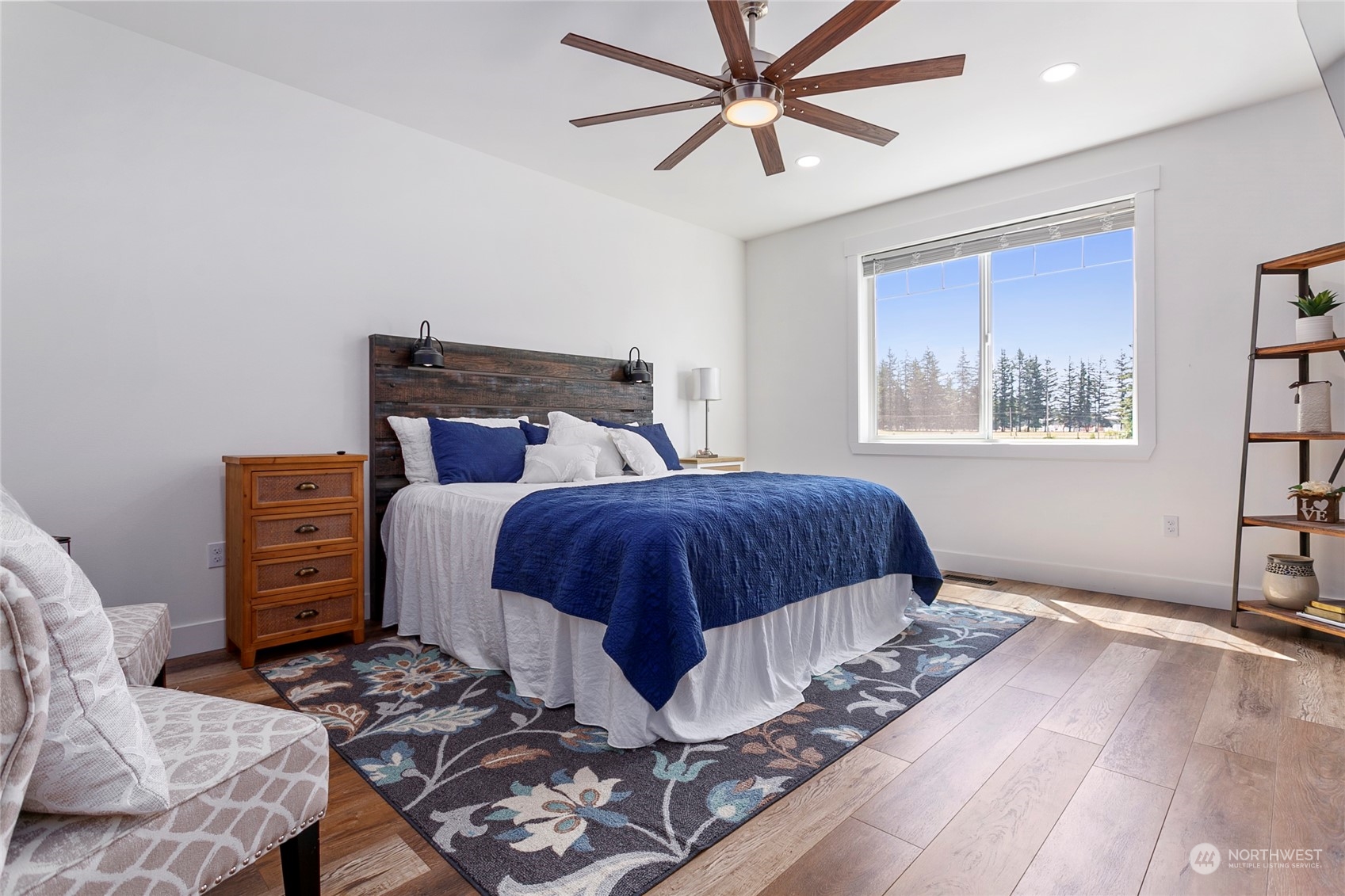 7730 Goodwin Road Everson, WA 98247 - Photo 18 of 39 a bedroom with a bed and wooden floor