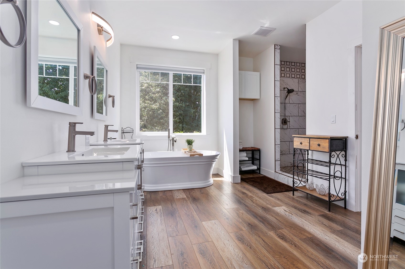 7730 Goodwin Road Everson, WA 98247 - Photo 19 of 39 a spacious bathroom with double vanity and a bathtub