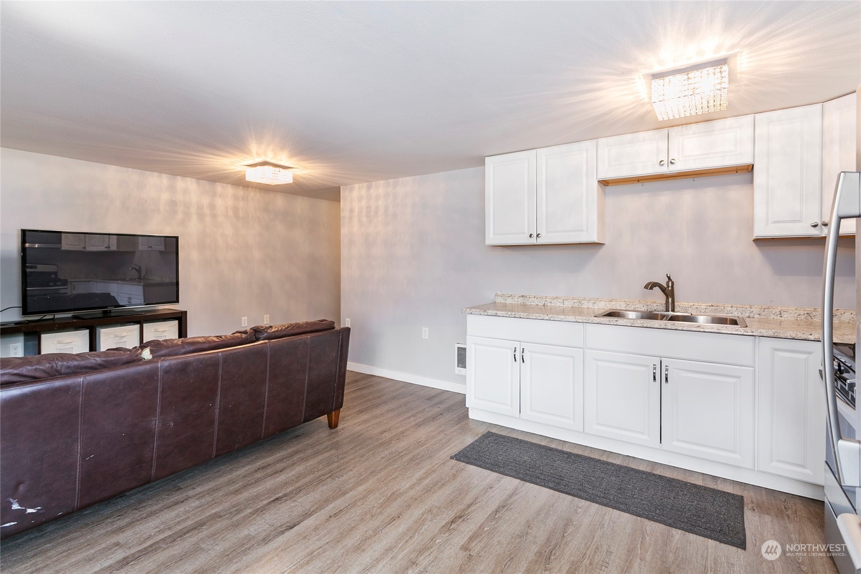 7730 Goodwin Road Everson, WA 98247 - Photo 32 of 39 a living room with furniture and a flat screen tv
