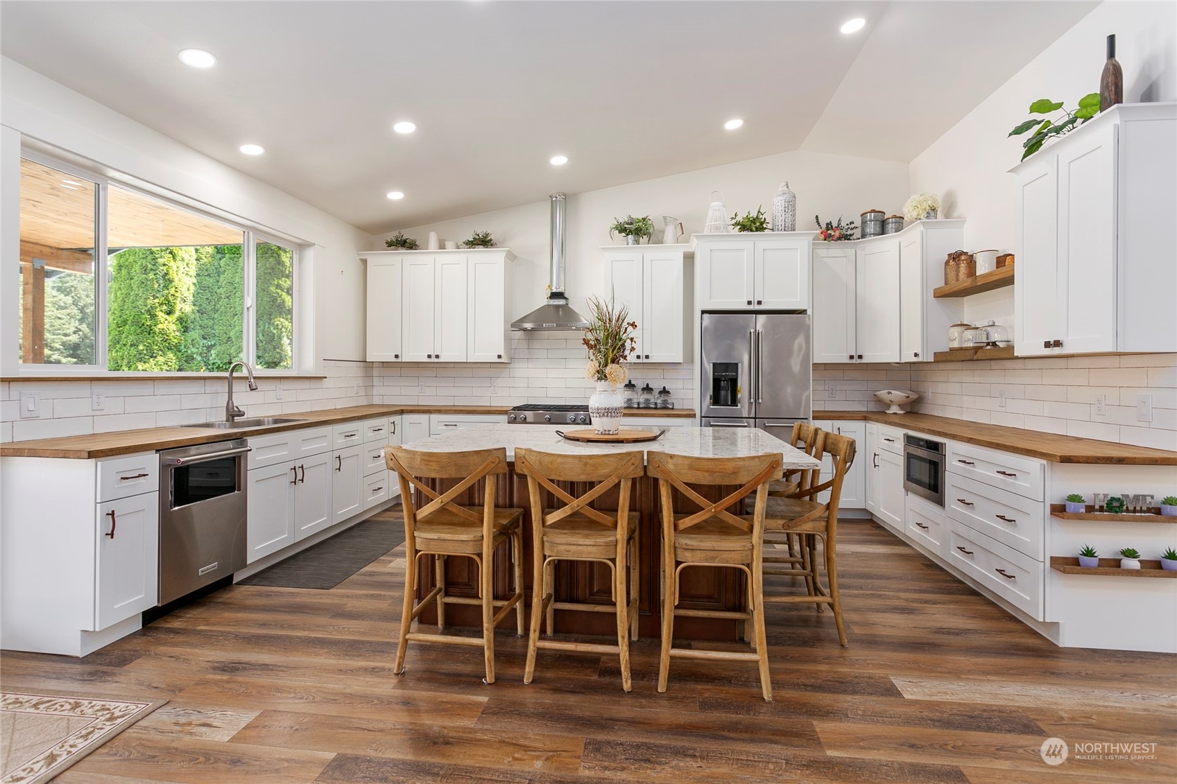 7730 Goodwin Road Everson, WA 98247 - Photo 8 of 39 a large kitchen with a table and chairs in it