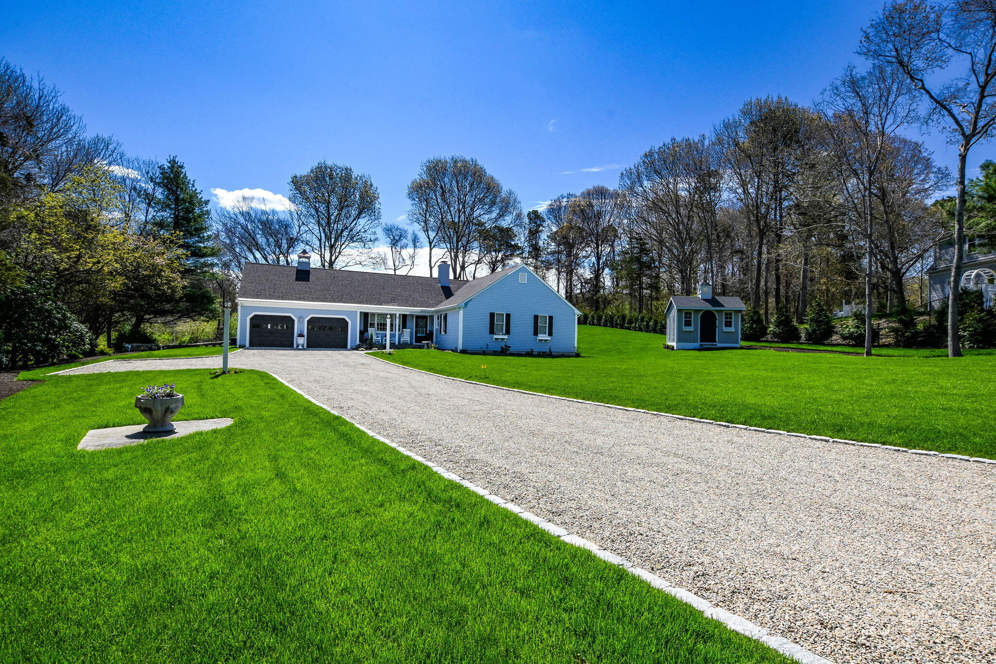 9 Coach Lane Sandwich, MA 02563 - Photo 2 of 38 a view of a house with a big yard and large trees