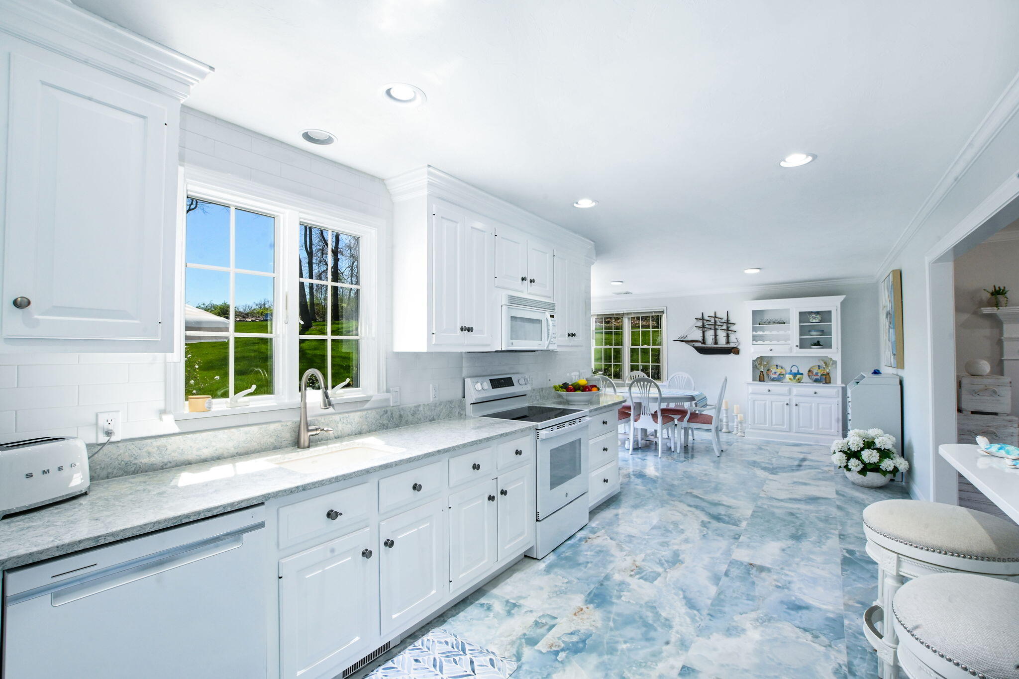 9 Coach Lane Sandwich, MA 02563 - Photo 21 of 38 a kitchen with sink cabinets and window