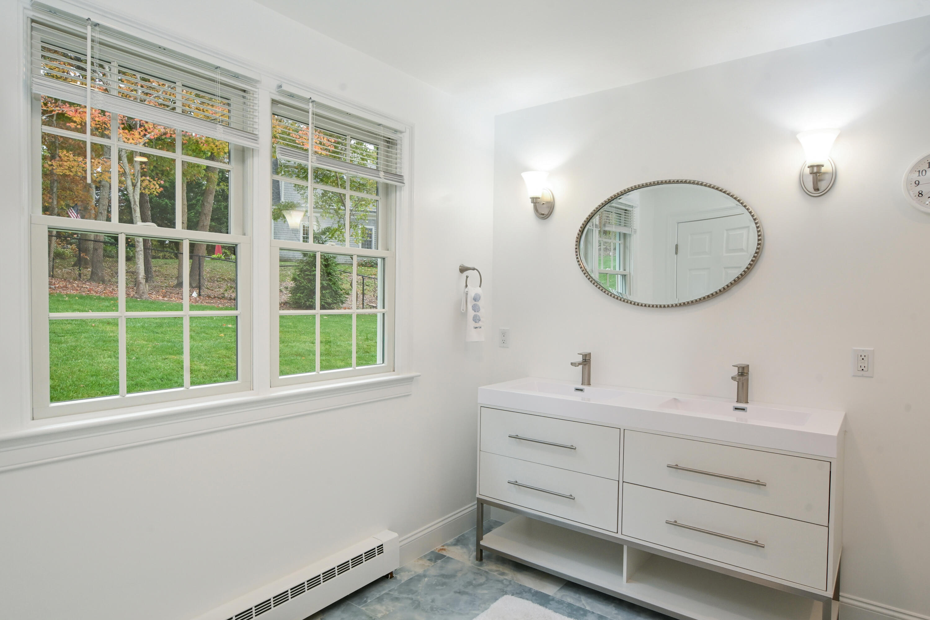 9 Coach Lane Sandwich, MA 02563 - Photo 30 of 38 a bathroom with a sink and a mirror