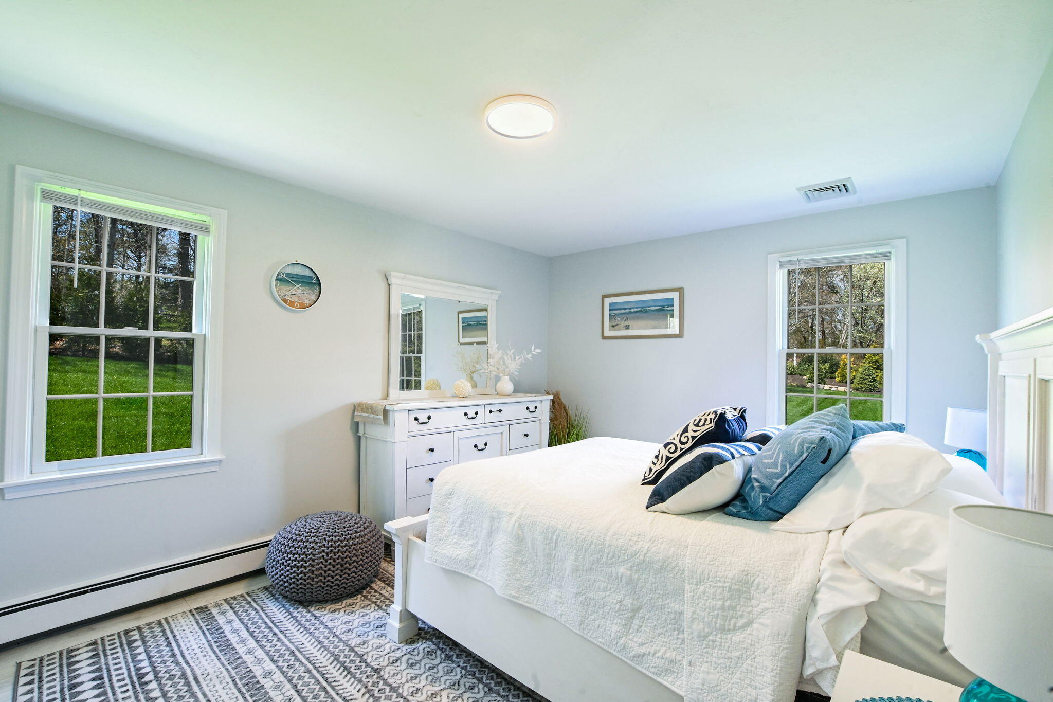 9 Coach Lane Sandwich, MA 02563 - Photo 32 of 38 a bedroom with a bed and wooden floor
