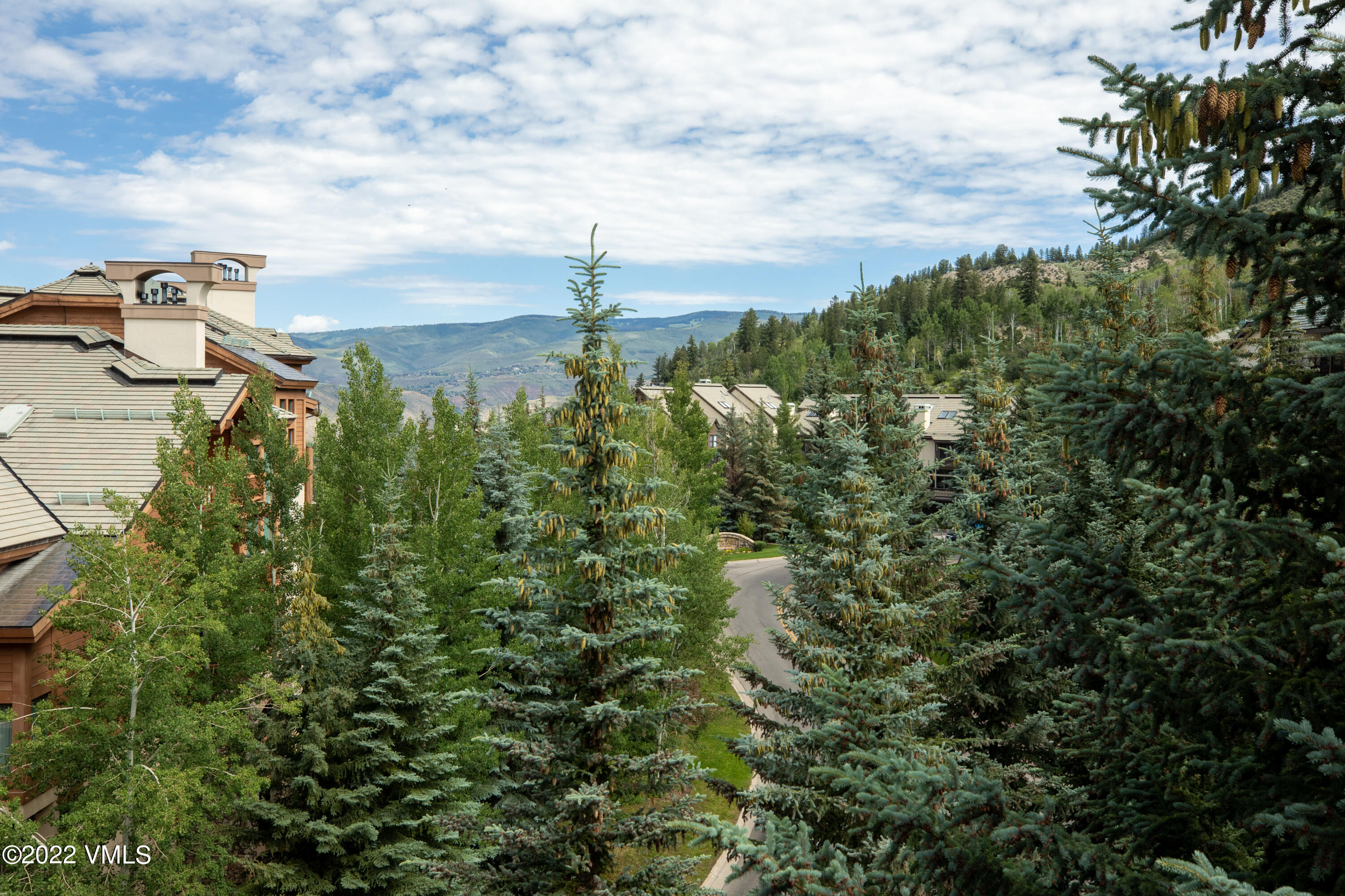 120 Offerson Road, Unit E440 Beaver Creek, CO 81620 - Photo 17 of 22 a view of a lake with houses