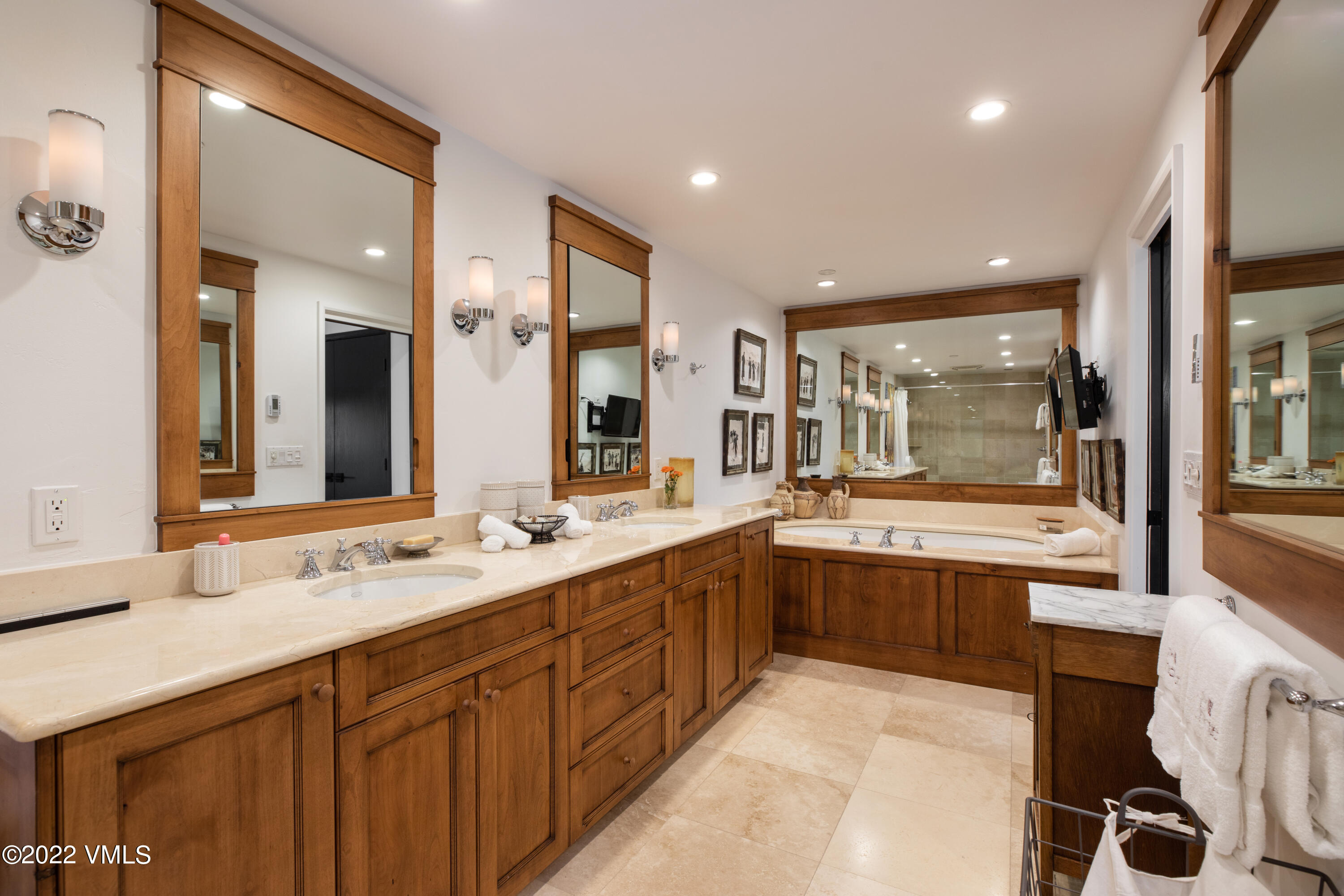 120 Offerson Road, Unit E440 Beaver Creek, CO 81620 - Photo 8 of 22 a large bathroom with a large mirror vanity and sink