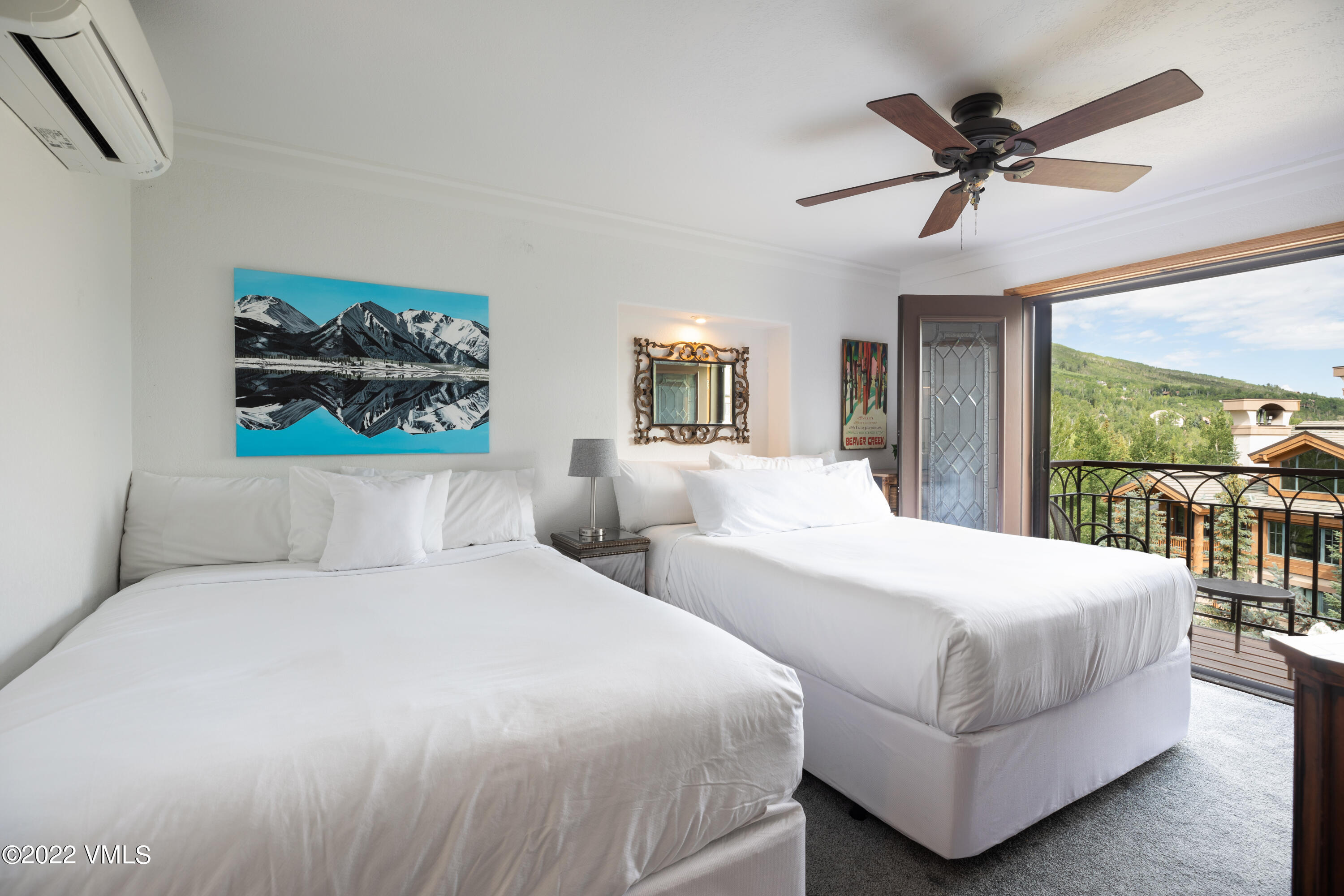 120 Offerson Road, Unit E440 Beaver Creek, CO 81620 - Photo 9 of 22 a bedroom with a large bed and a large window