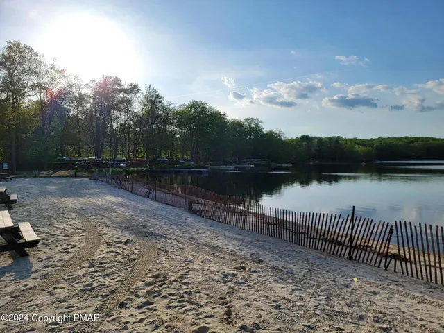 a view of a pathway with a wrought fence