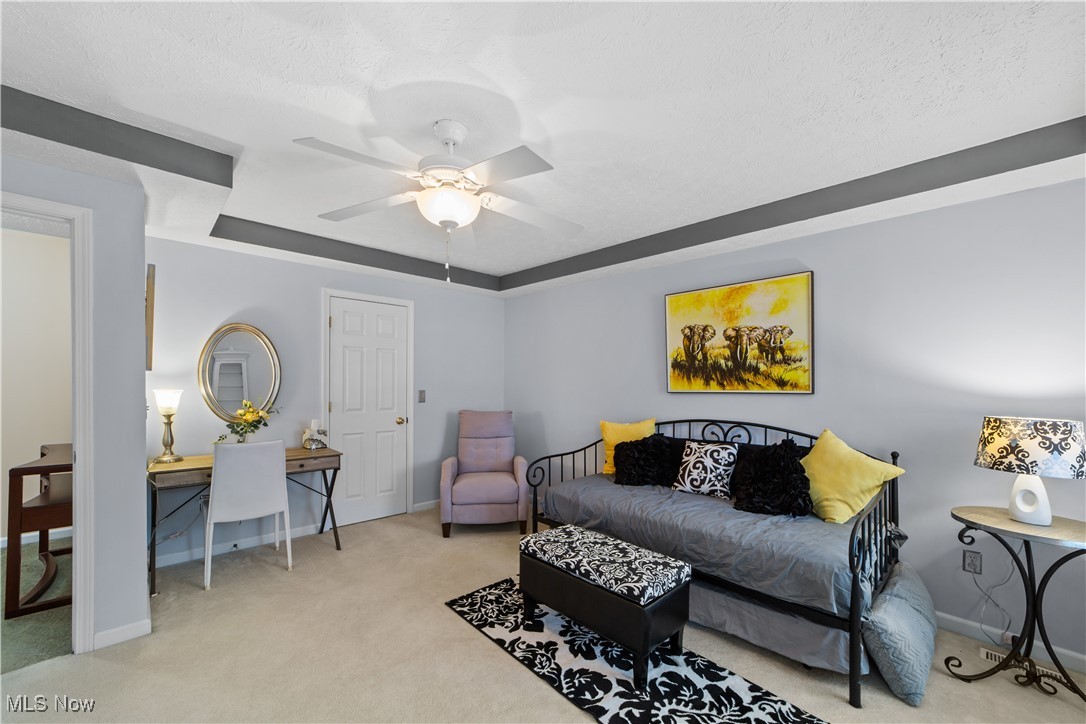 4461 Sexton Road Cleveland, OH 44105 - Photo 27 of 47 Carpeted bedroom with ceiling fan and a textured ceiling