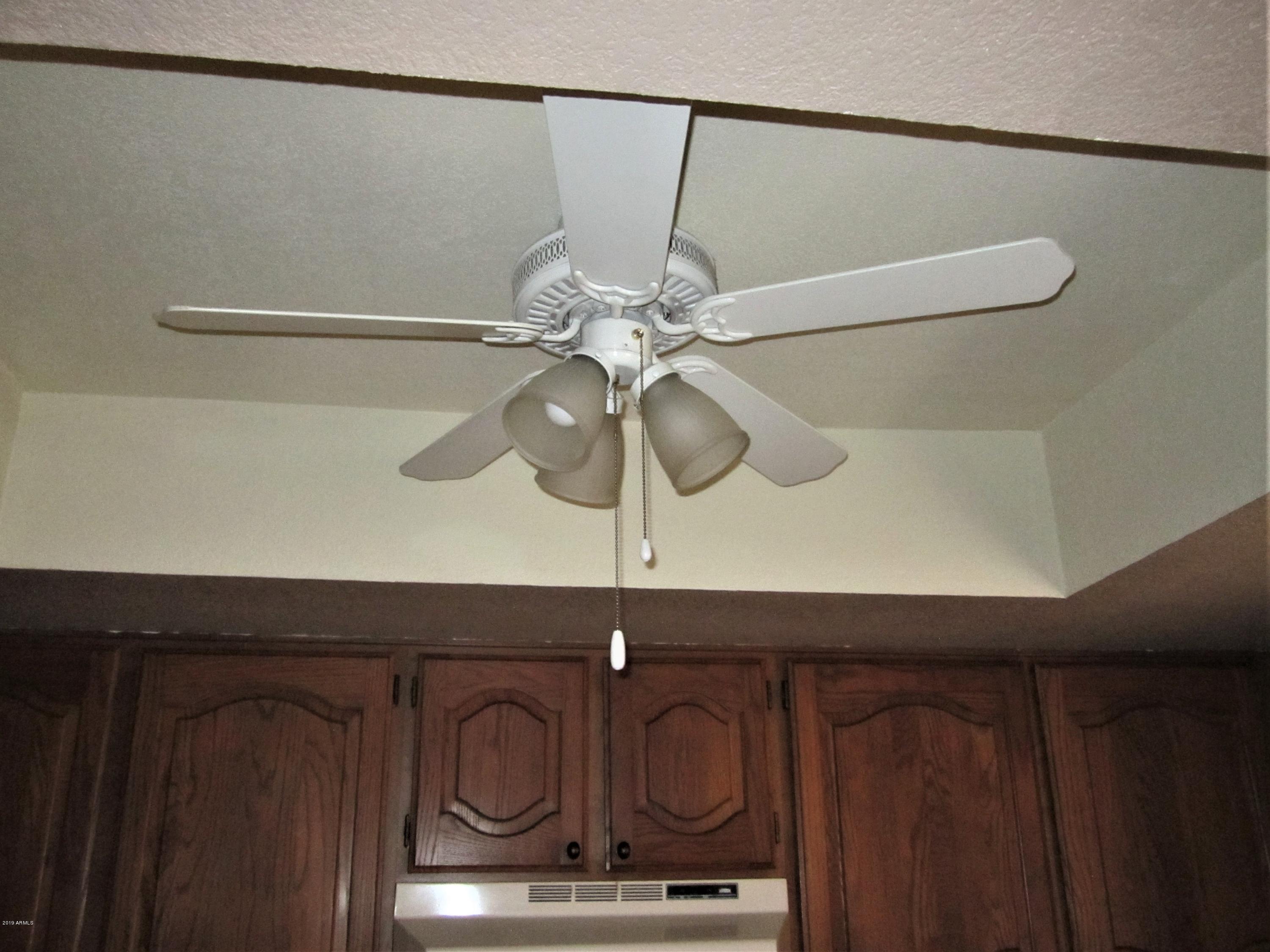 4303 East Cactus Road, Unit 116 Phoenix, AZ 85032 - Photo 19 of 35 a close view of light fixtures and wooden floor