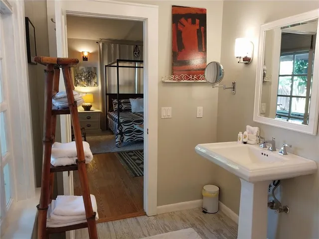 a bathroom with a sink and a mirror