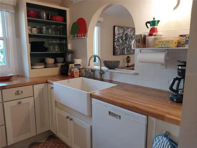 a kitchen with cabinets a sink and a stove