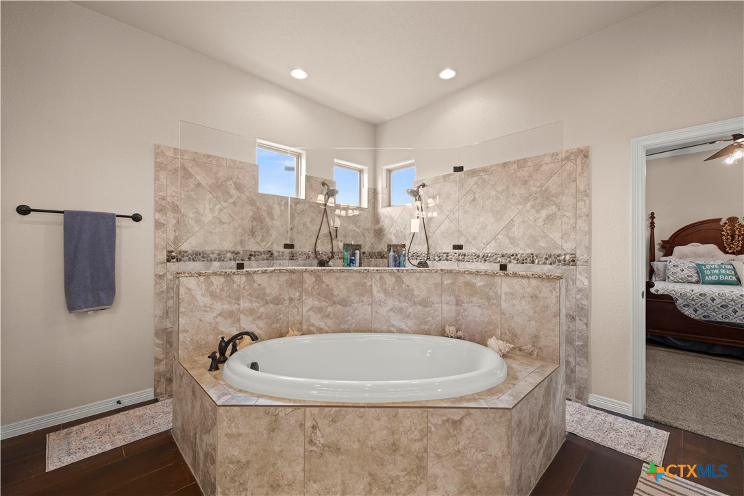 2649 Bowles Ranch Road Belton, TX 76513 - Photo 18 of 36 a bath tub sitting in a bathroom