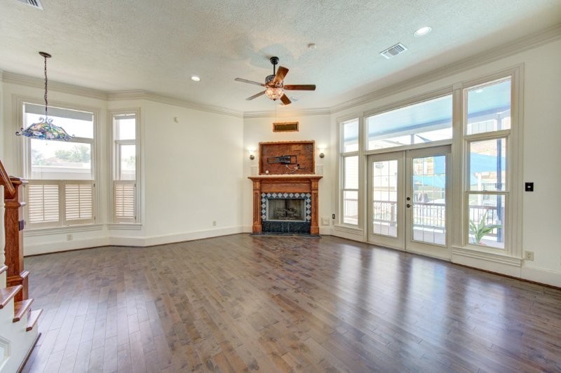 122 Vieux Carre Drive Houston, TX 77009 - Photo 16 of 47 a view of an empty room with a window and wooden floor