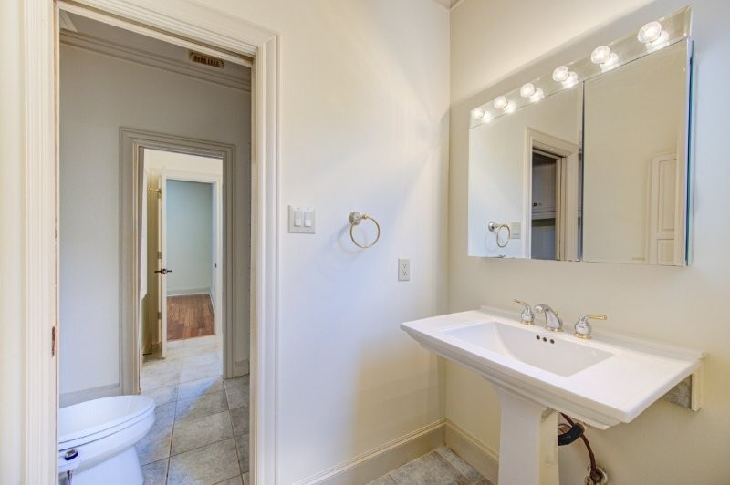 122 Vieux Carre Drive Houston, TX 77009 - Photo 21 of 47 a bathroom with a sink a mirror and a toilet