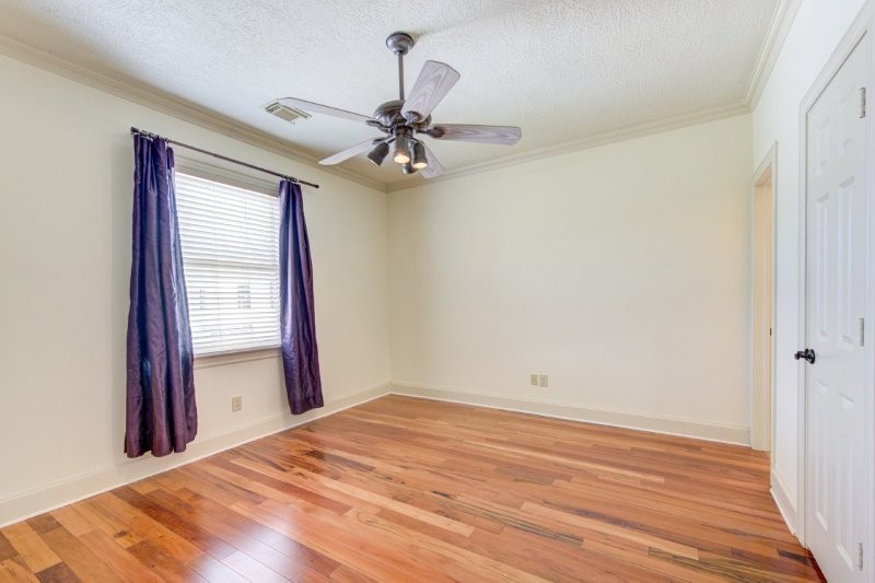 122 Vieux Carre Drive Houston, TX 77009 - Photo 23 of 47 a view of a room with wooden floor and fan